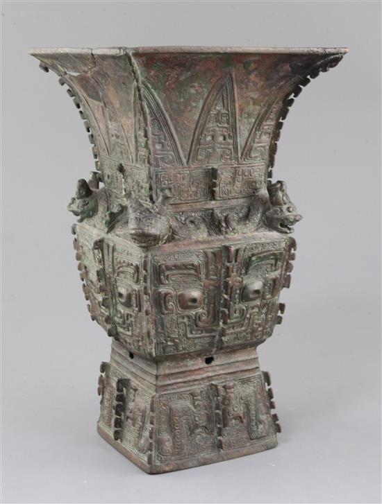 A rare Chinese archaic bronze ritual wine vessel, Fangzun, Shang dynasty, 13th-11th century B.C., 33.5cm high, losses and repairs